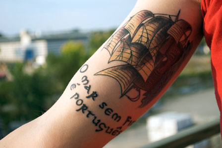 an image of a tattoo made with the Uncial Font from the Divers Handes font set
